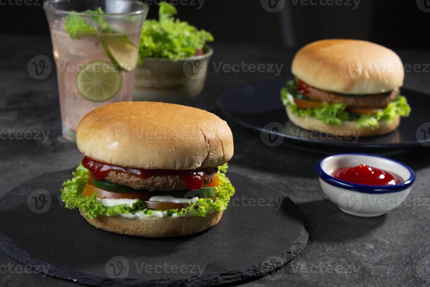 Delicious fresh meat burgers with tomato sauce. photo