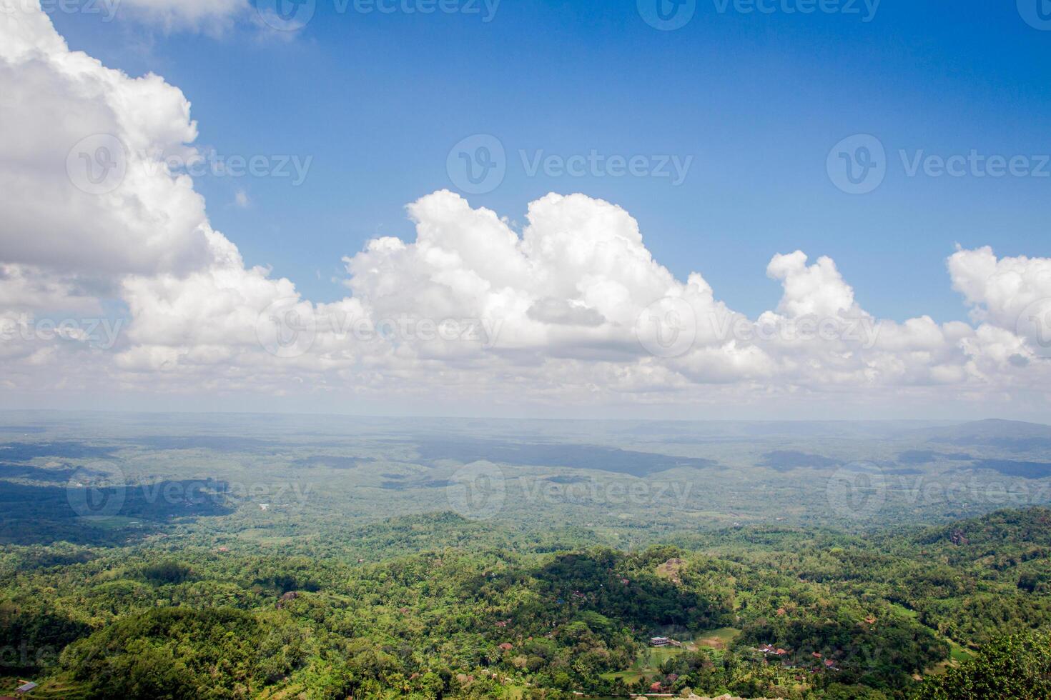 collection of clouds in blue sky in summer with wilderness view. photo