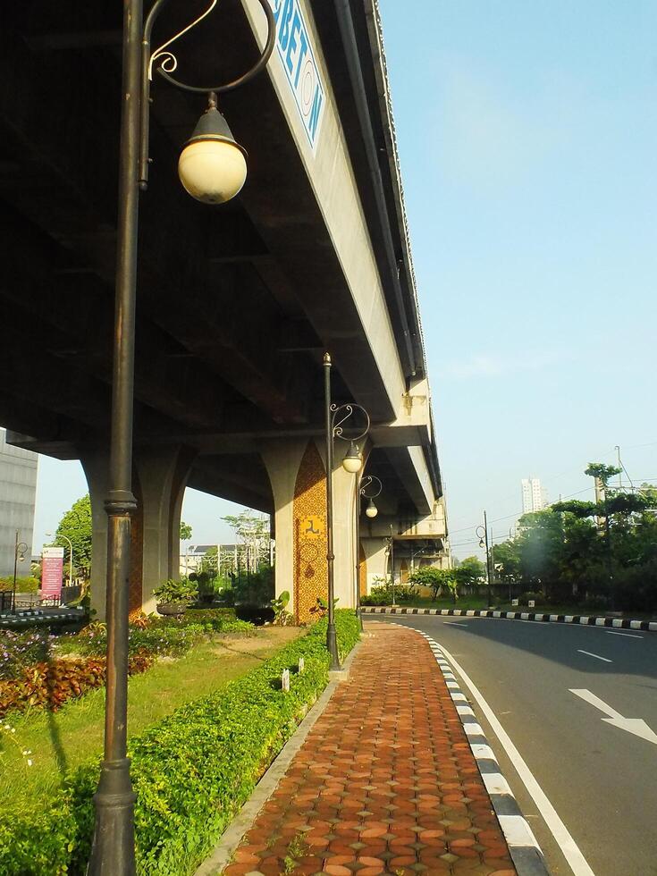 Surakarta, Central Java, Indonesia April 11, 2024. A sight seeing of Main Roads Slamet Riyadi Street in the morning. Not busy yet. People still preparing for their activity photo
