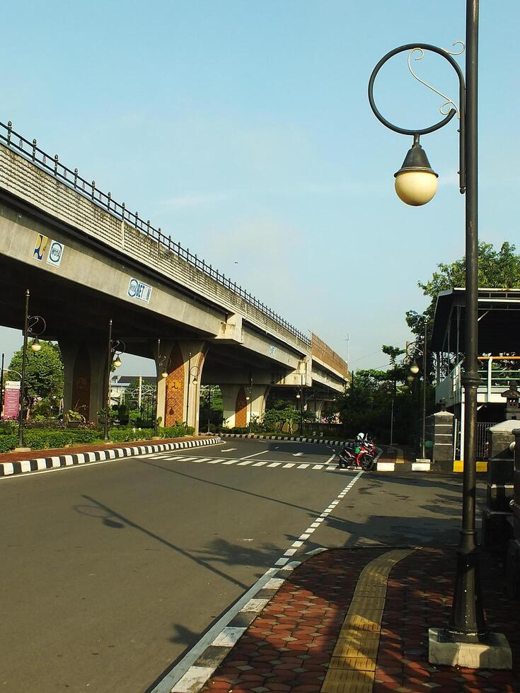 Surakarta, Central Java, Indonesia April 11, 2024. A sight seeing of Main Roads Slamet Riyadi Street in the morning. Not busy yet. People still preparing for their activity photo