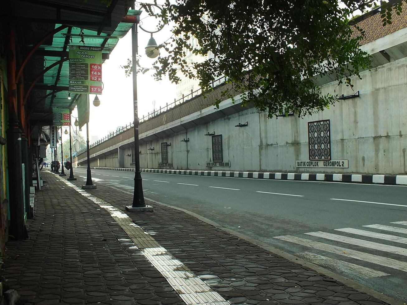 Surakarta, Central Java, Indonesia April 11, 2024. A sight seeing of Main Roads Slamet Riyadi Street in the morning. Not busy yet. People still preparing for their activity photo