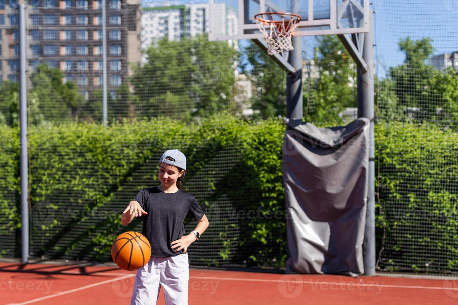 Concentration. Teen girl, basketball player in motion with ball, dribbling. Concept of sportive lifestyle, active hobby, health, endurance, competition photo