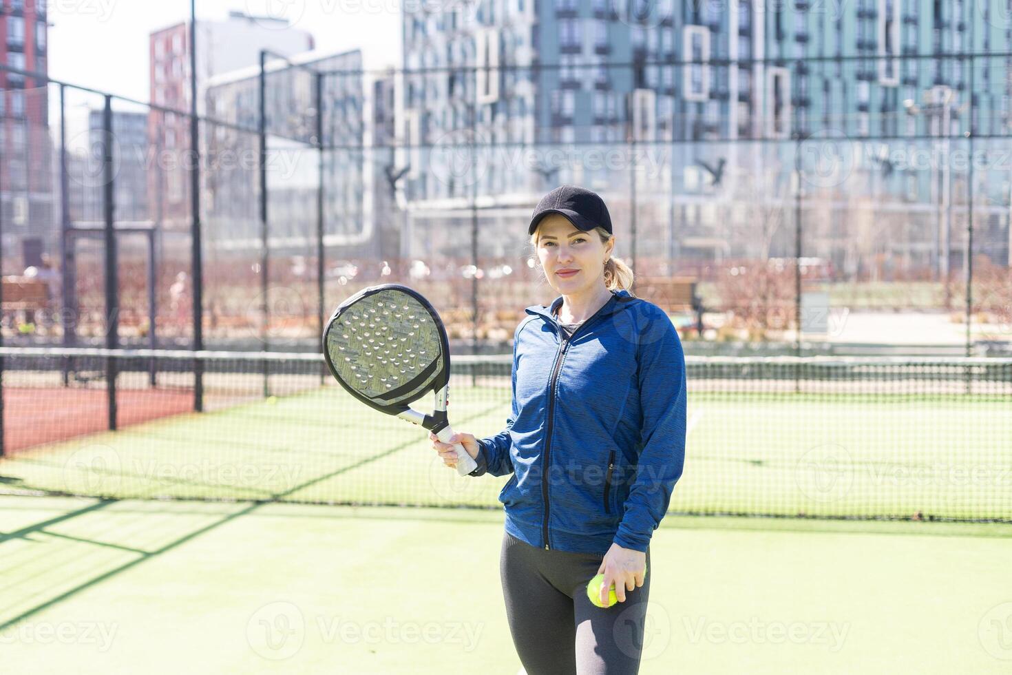 One women playing Paddle tennis photo