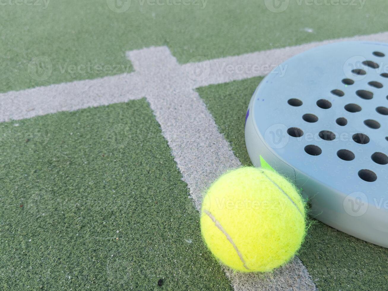 padel tennis racket sport court and balls. photo