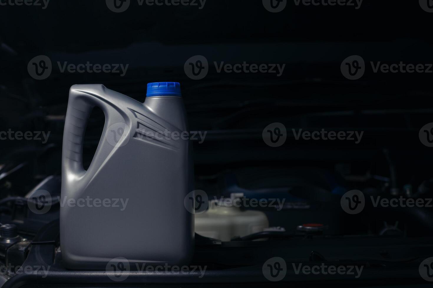lubricant bottle On the background of engine lubricant, oil change shop, engine service industry. photo