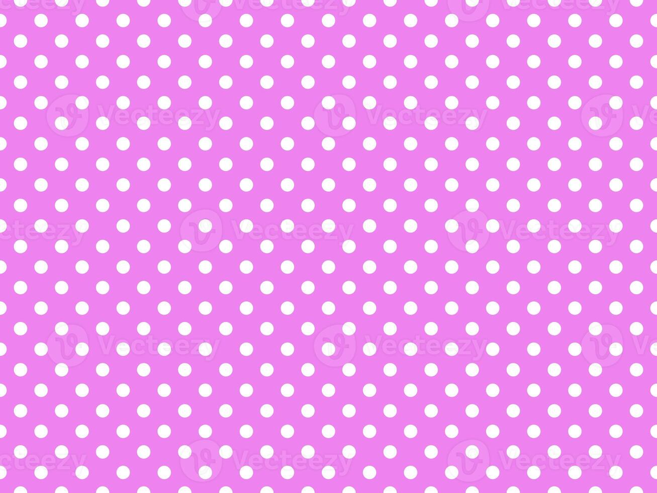 white polka dots over violet background photo