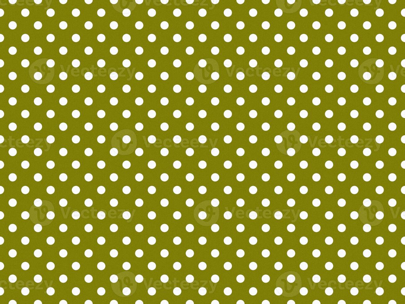 texturised white color polka dots over olive green background photo