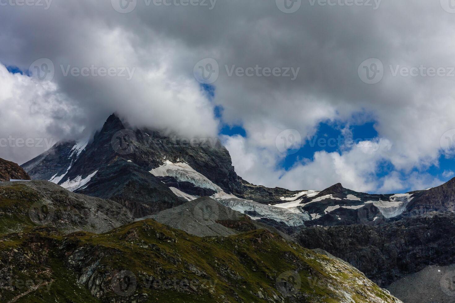 Panorama of cloud layer from mountain top over Swiss alps photo
