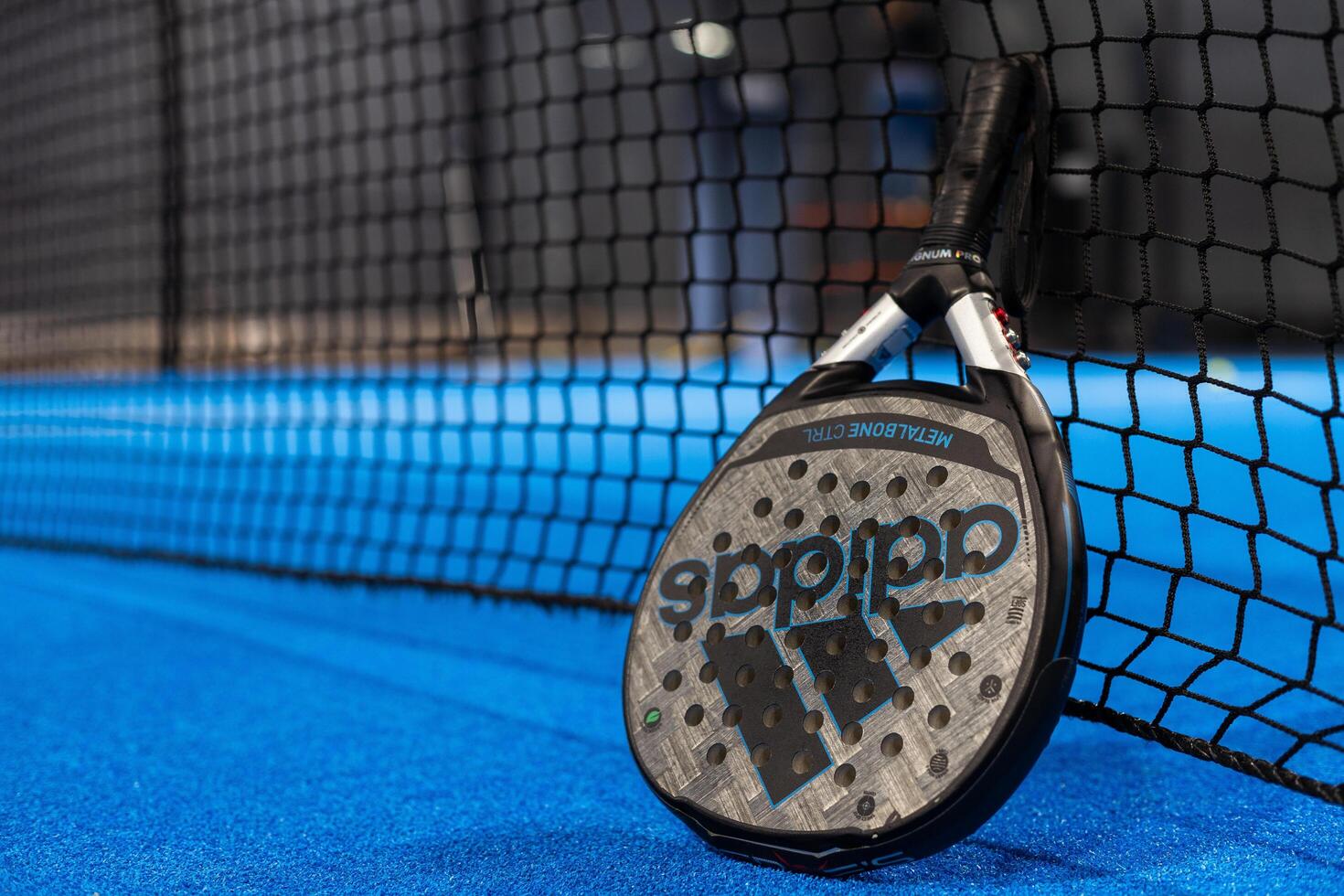 Side view of padel tennis racket in puddle close up. Generated by artificial intelligence 47536658 Stock Photo at Vecteezy