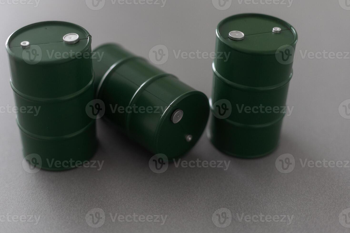 models of barrels with oil on the table photo