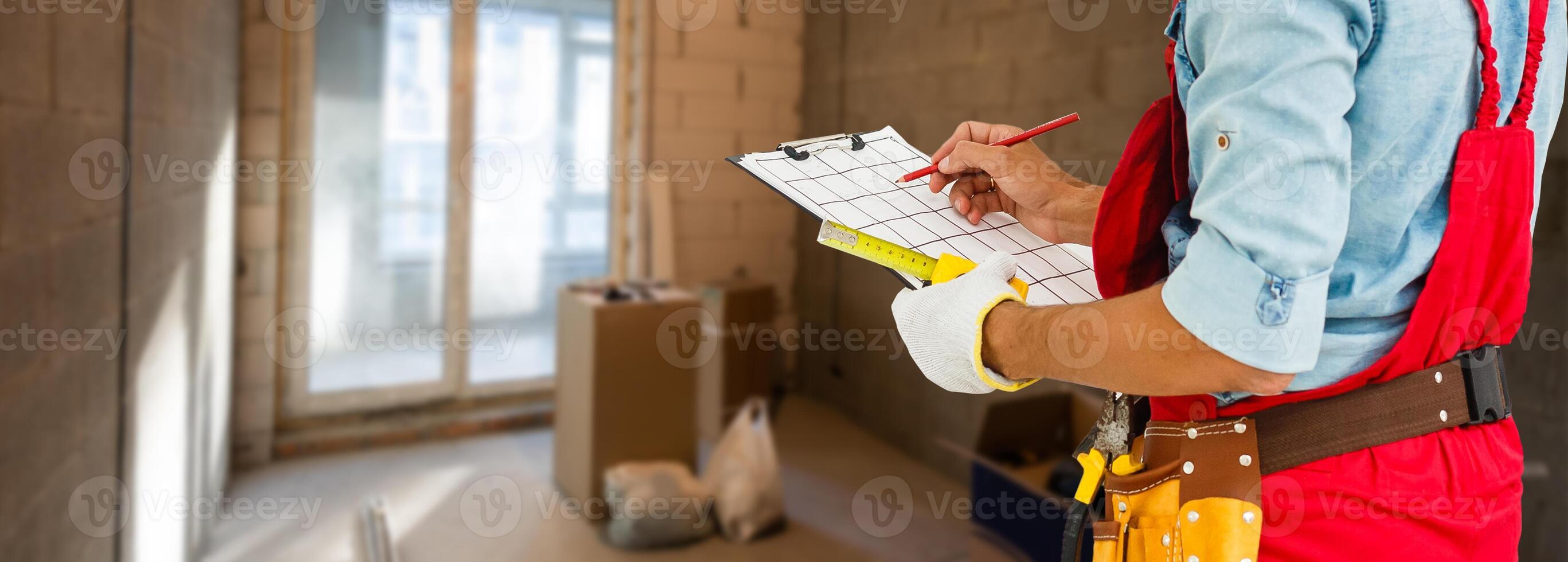 Worker with a tool belt photo