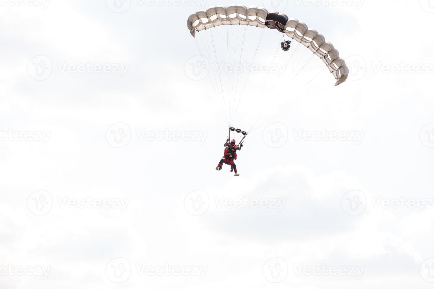 Skydiving. Tandem jump. An amazing adventure into the sky. photo