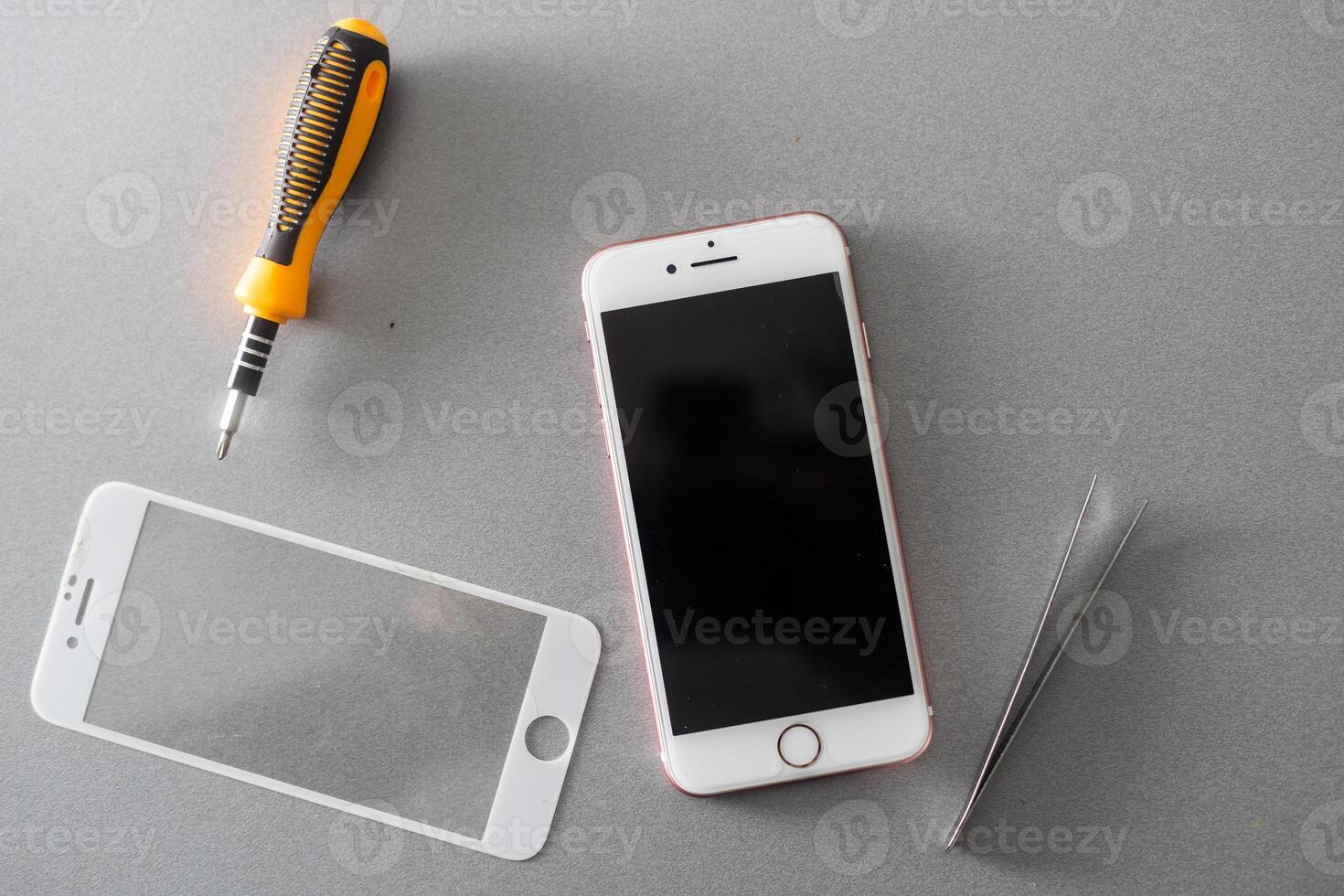 Smart solution technology concept. cropped photo replacement of protective film with a new one. Man carefully removes old protective glass from the smartphone screen.