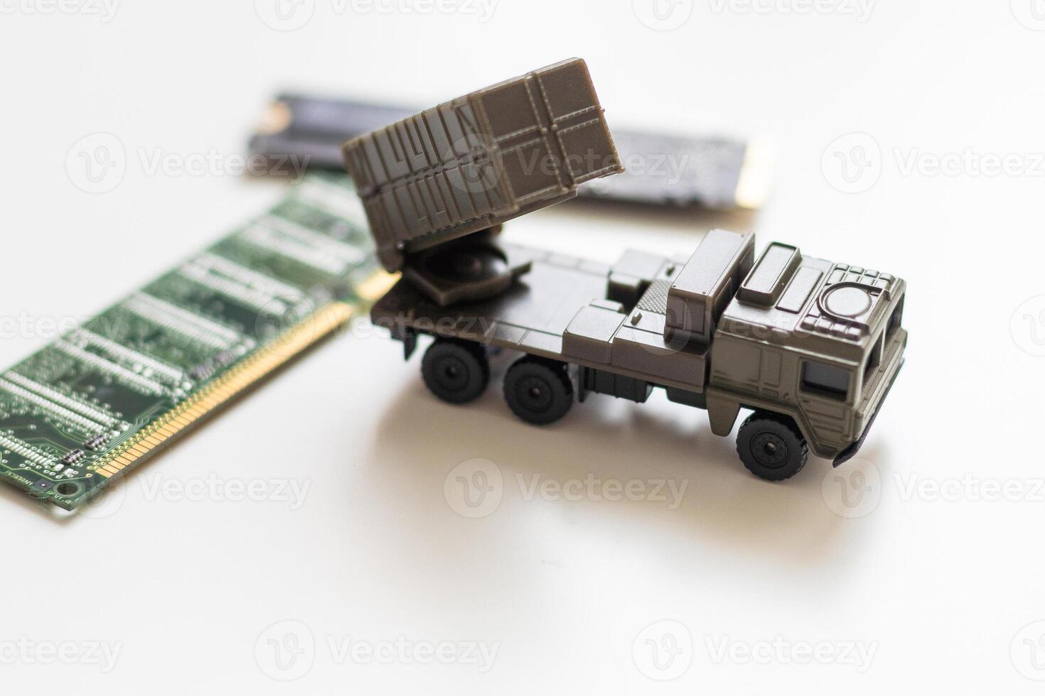 A toy military vehicle with a rocket and microcircuit photo