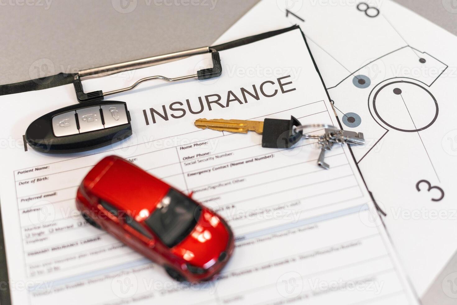 Car insurance form with model and policy document photo