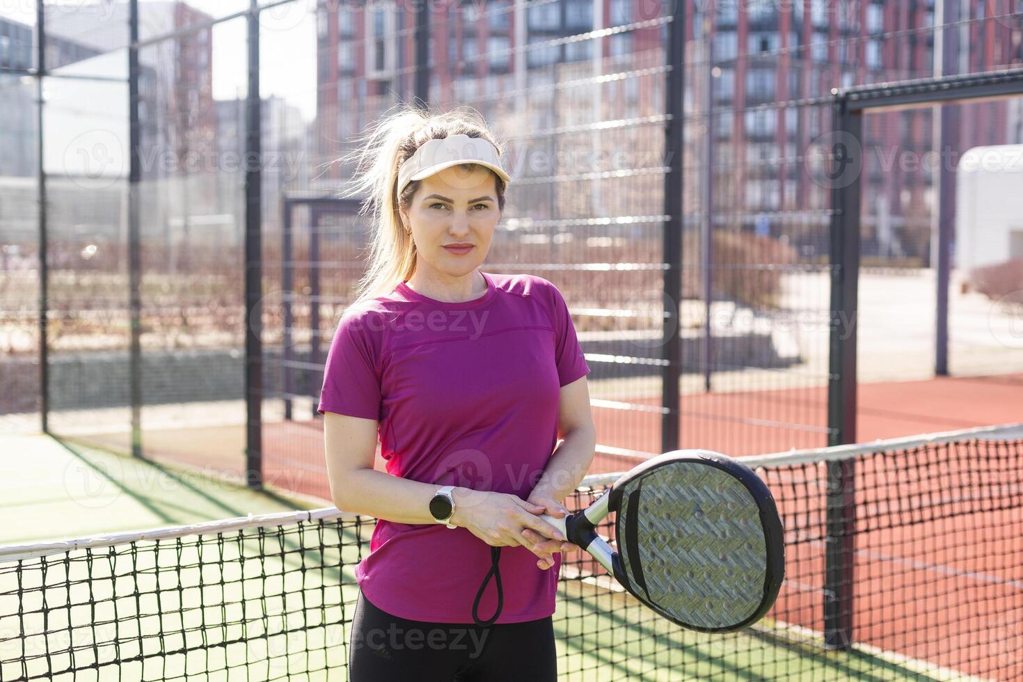 One women playing Paddle tennis photo
