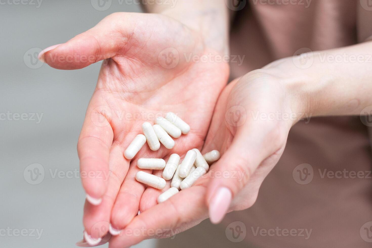 Medicine in hand on a white background photo