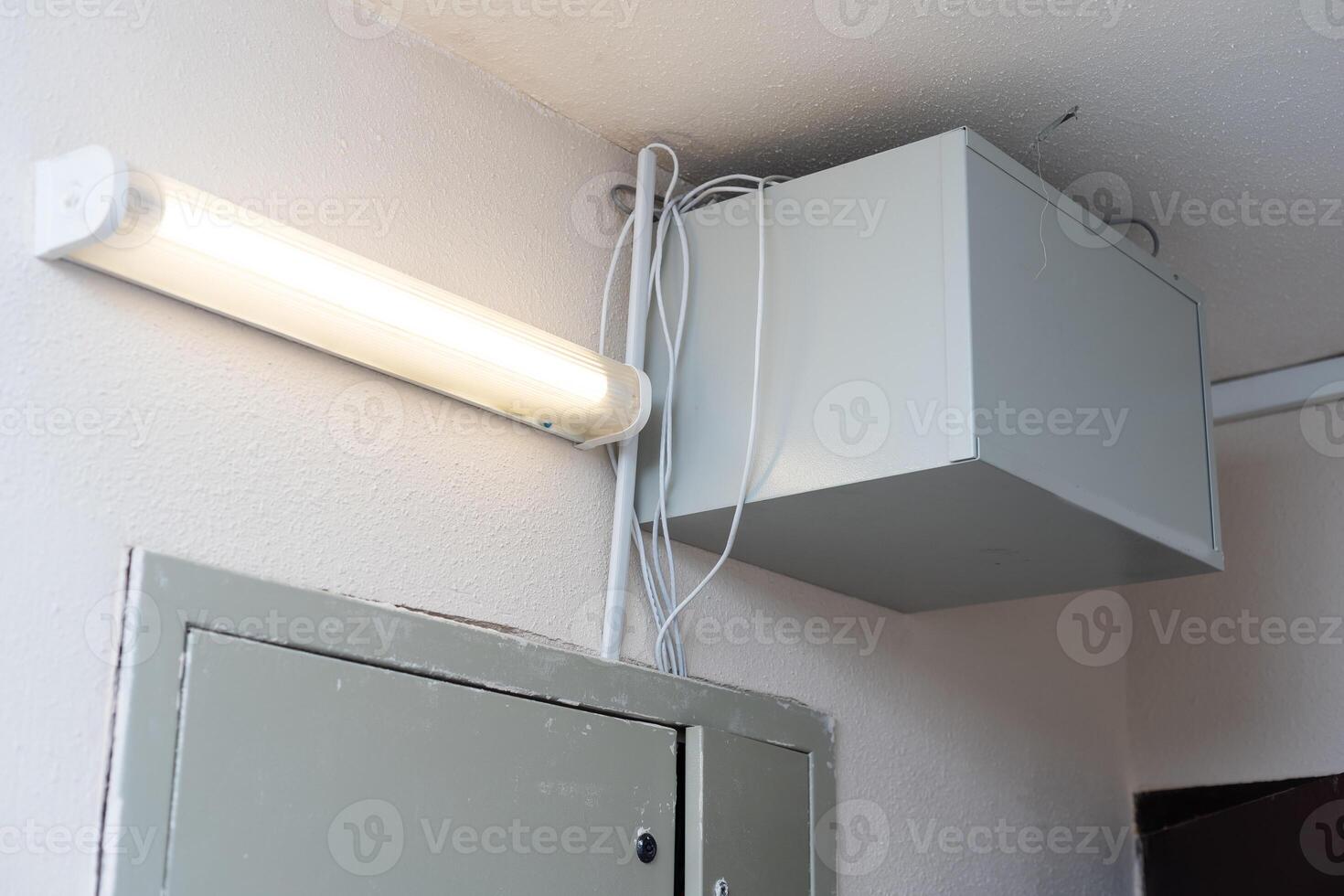 Electric cabinet with Internet and television cables in an apartment building. Niche for wires and cables inside the wall photo