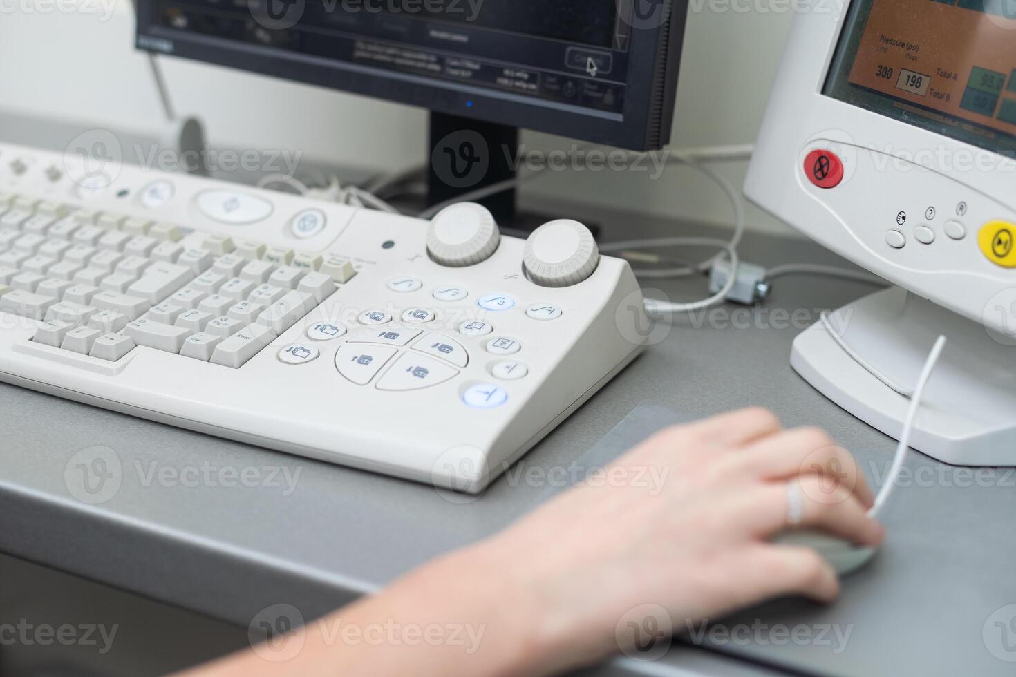 Doctor using laptop and electronic medical record , EMR system. Digital database of patient's health care and personal information on computer screen. Hand on mouse and typing with keyboard photo
