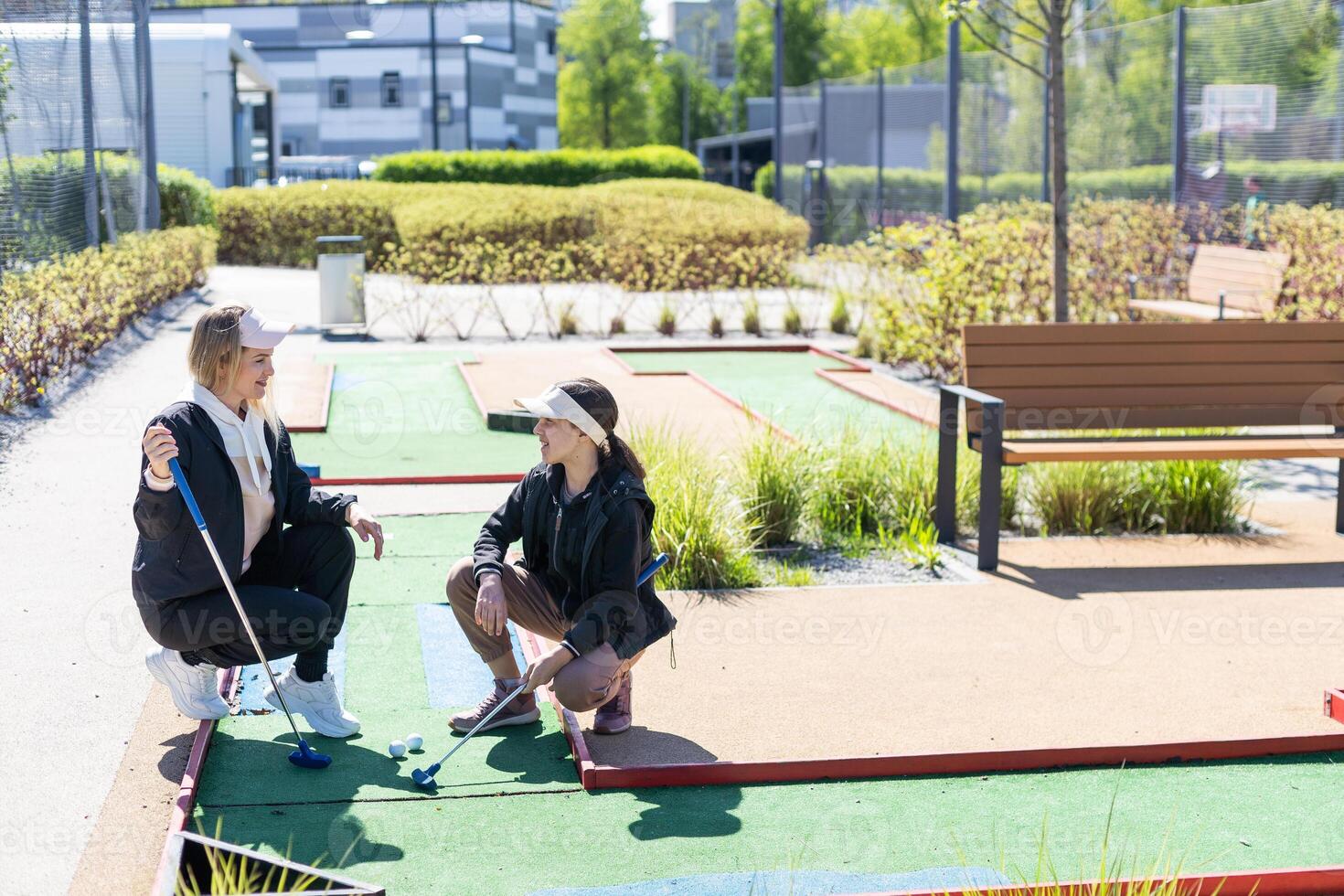 Family Time Playing Mini-Golf In The Summer photo