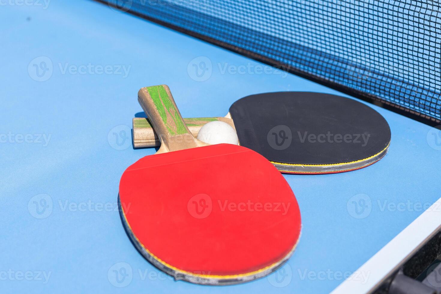 table tennis ball and paddle photo
