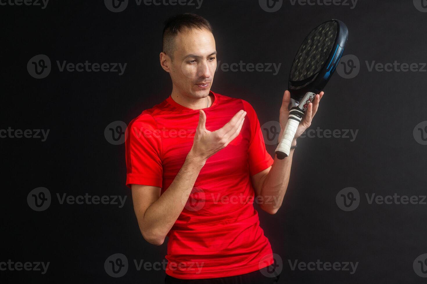 Paddle tennis. Man, Player with hand and Paddel racket and ball photo