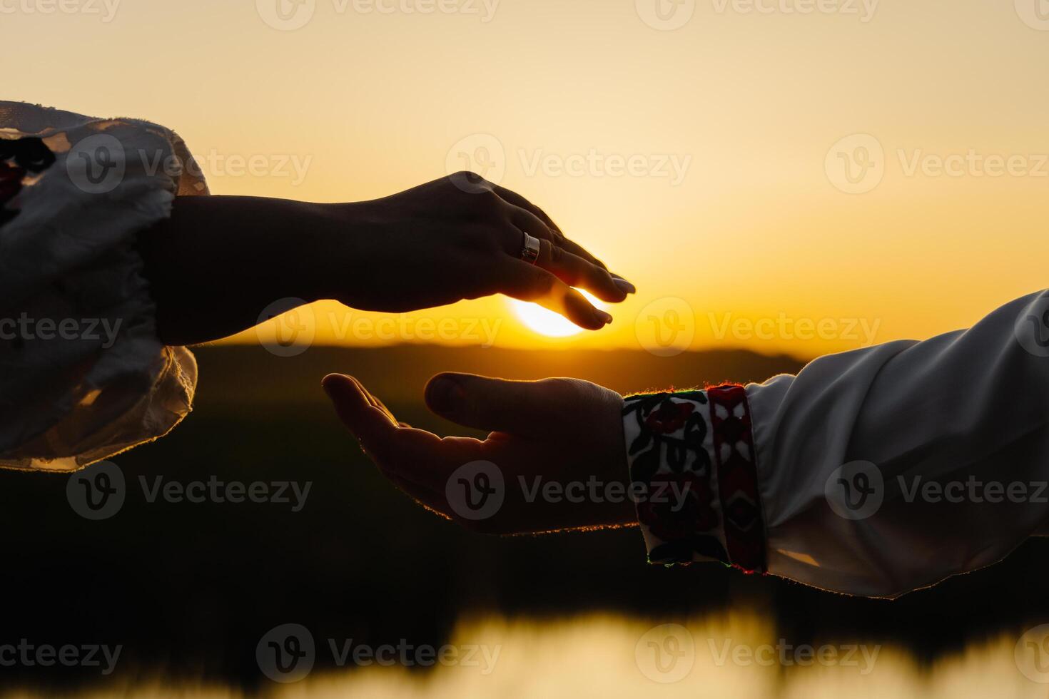 Intimate moment between two people holding hands photo