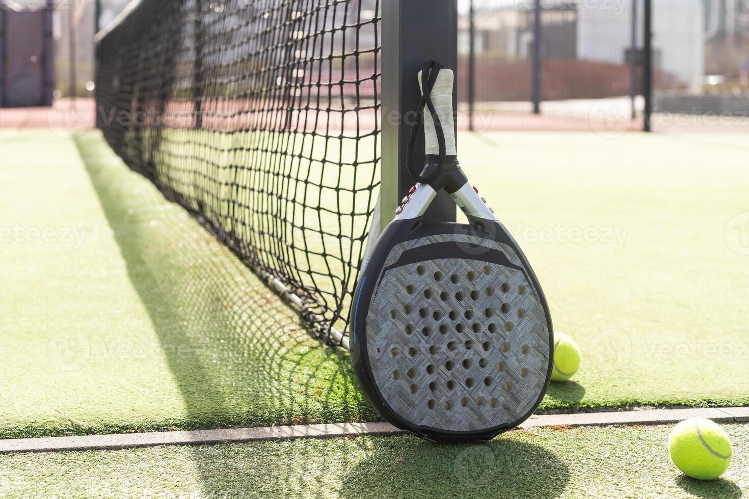 Paddle tennis racket and ball photo
