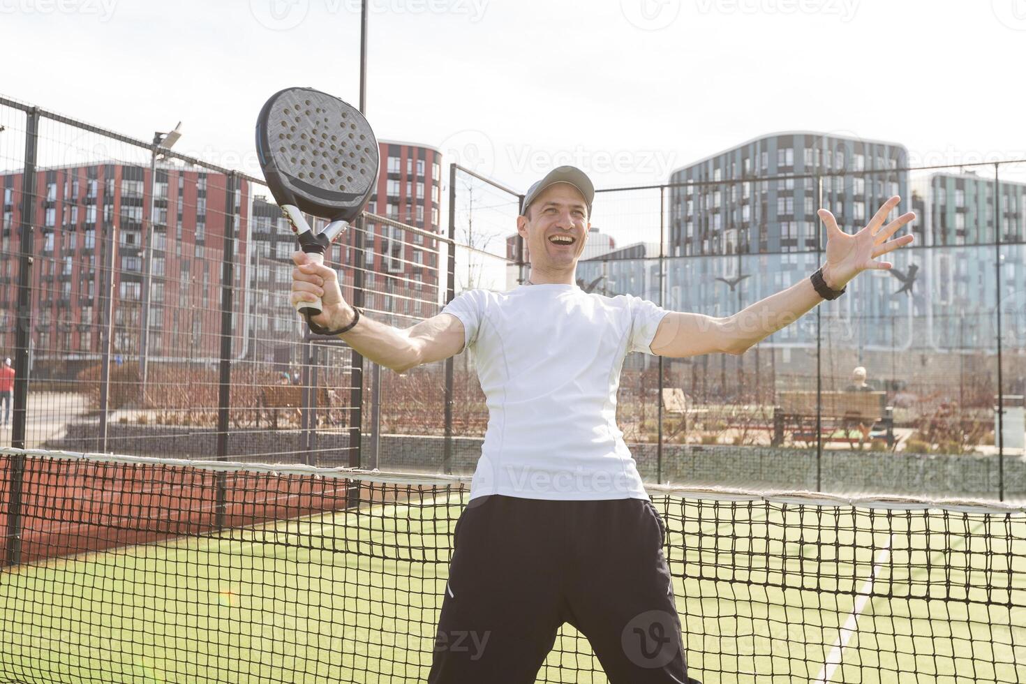 Padel match in a grass padel court - Padel player playing a match photo
