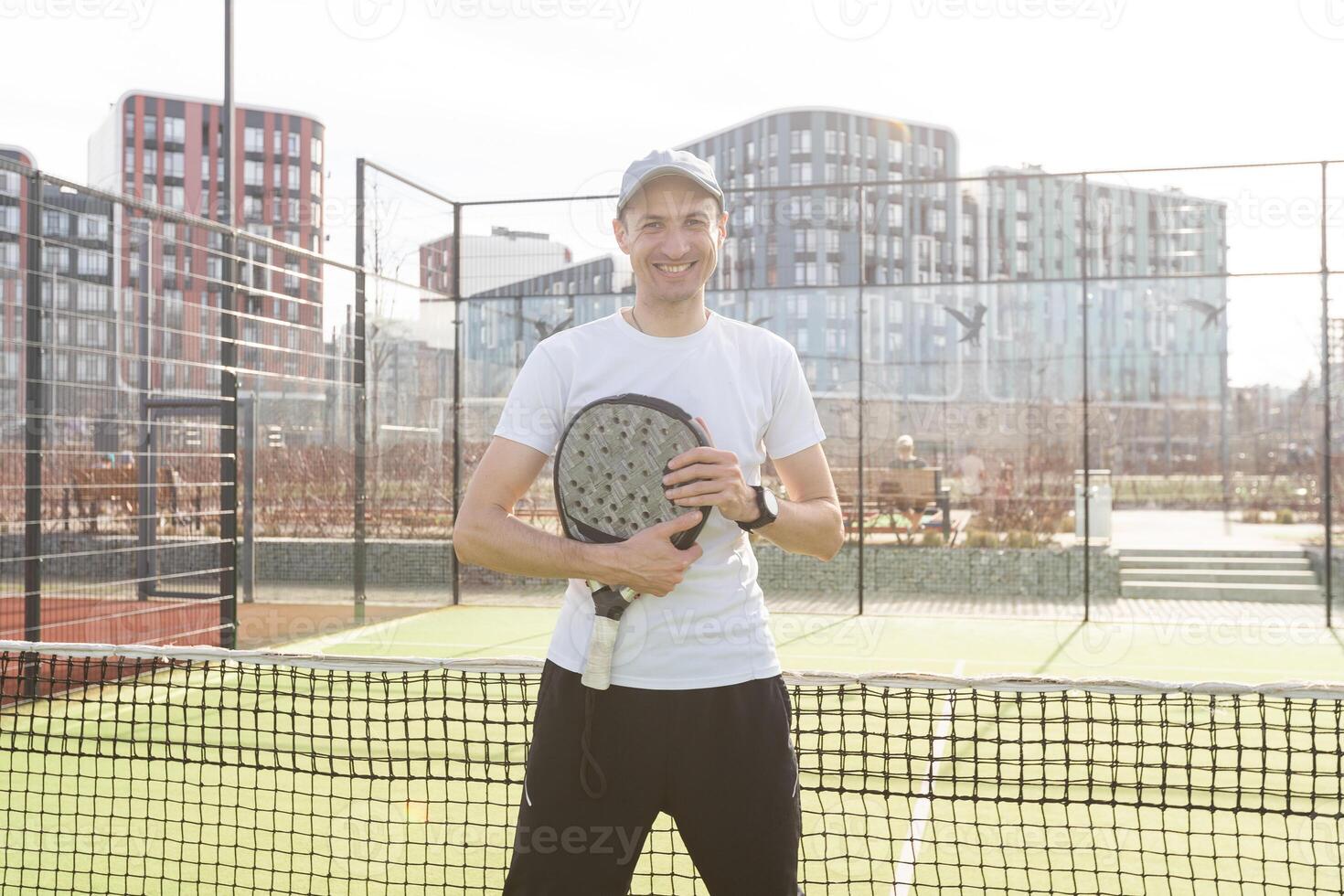 Padel match in a grass padel court - Padel player playing a match photo
