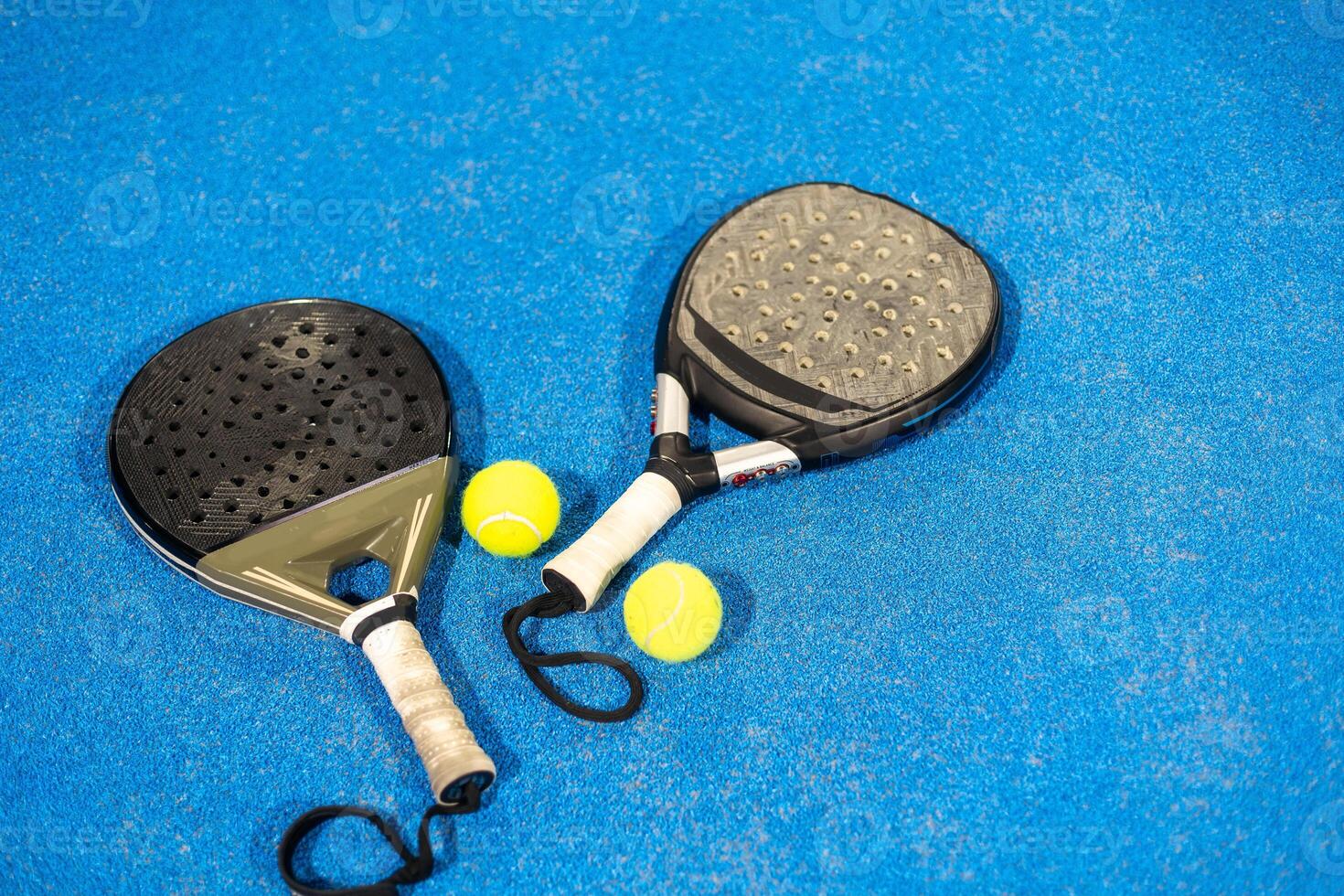 Padel tennis racket. Background with copy space. Sport court and balls. photo