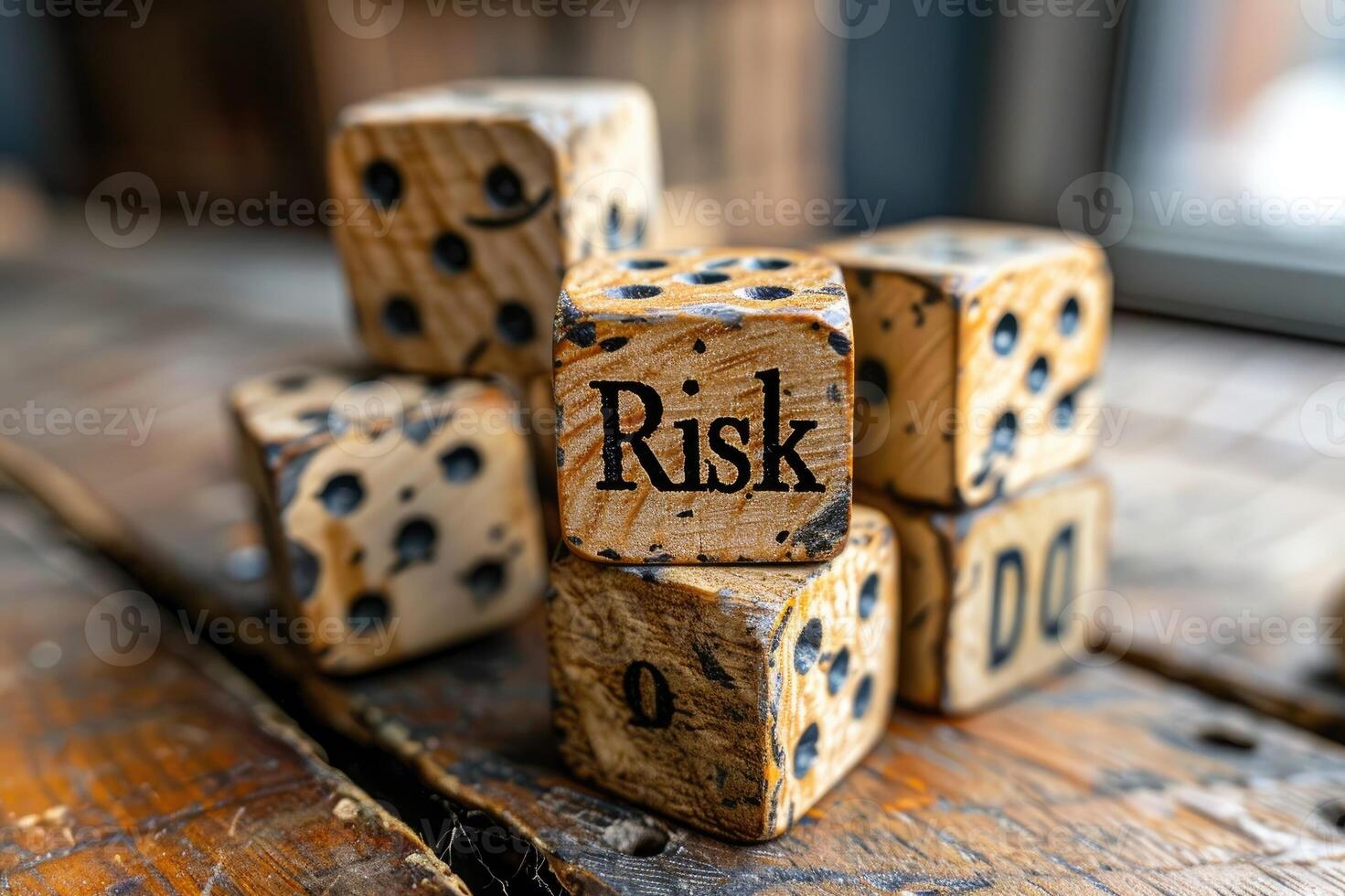 Wooden blocks spelling Risk on the table photo