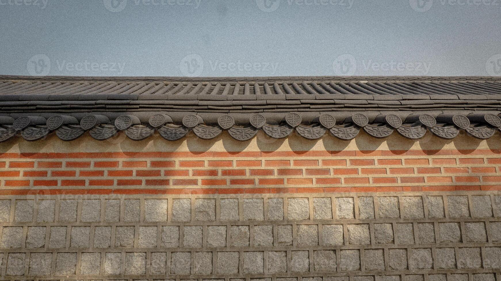 Traditional Korean Roof Design Against a Clear Sky at Dusk photo