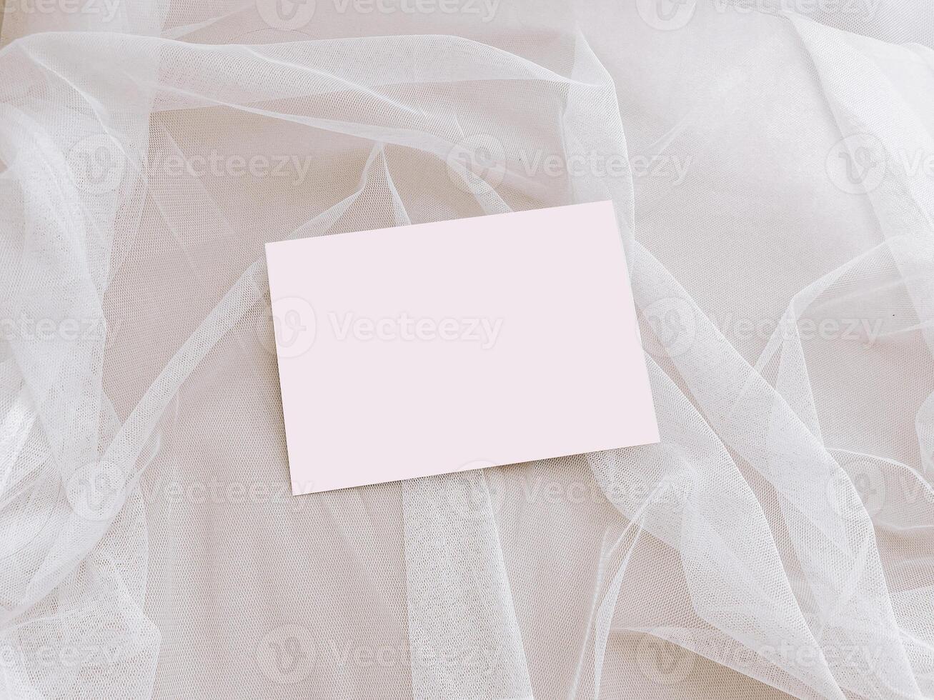 Blank Card on a Soft Tulle Fabric Background With Natural Light photo