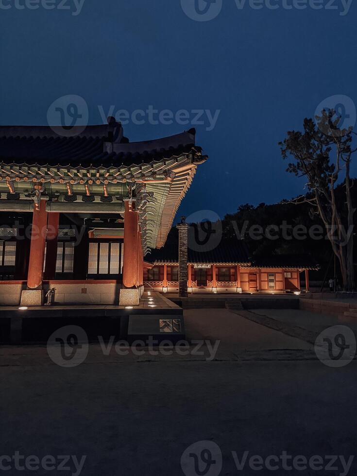 Traditional Korean Architecture Lit Up at Twilight photo