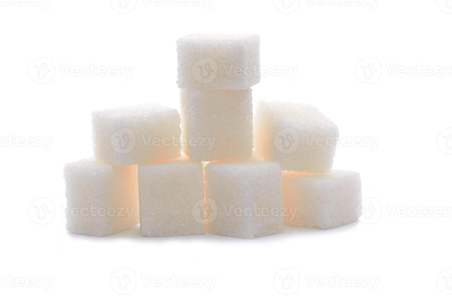 Sugar cubes on white photo