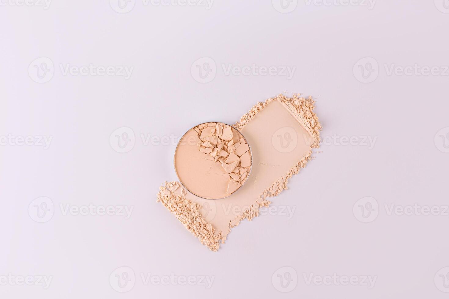 A block of beautiful compact powder with the presented texture stands on the powder sample. top view. white background. Product layout. A copy space. photo