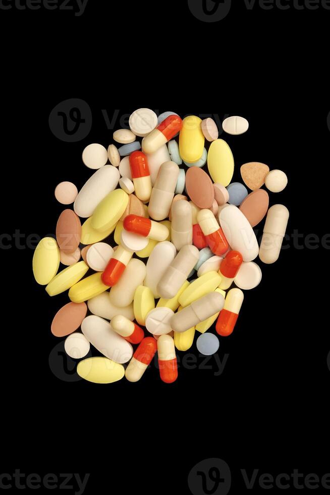 Many different colorful medications and pills. A pile of various multicolored drugs. photo