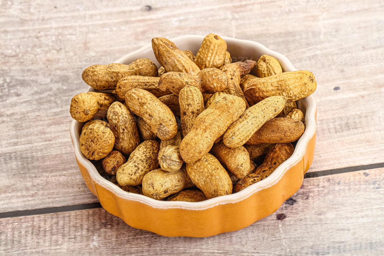 Raw ripe unpeeled peanut heap photo