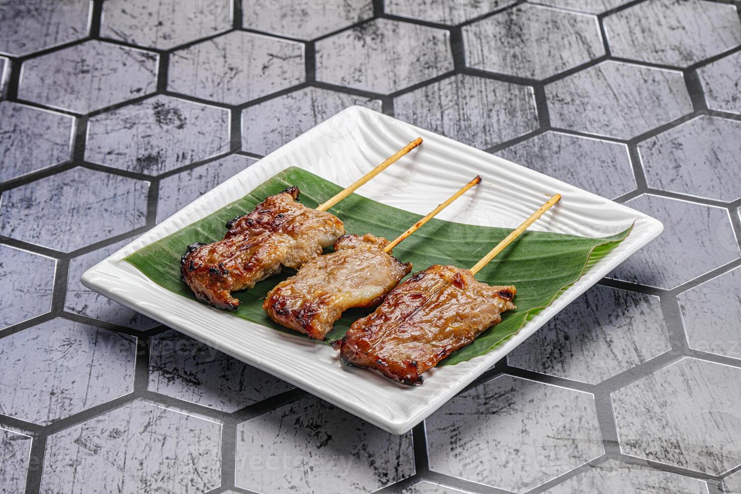 Thai cuisine - grilled pork skewer photo