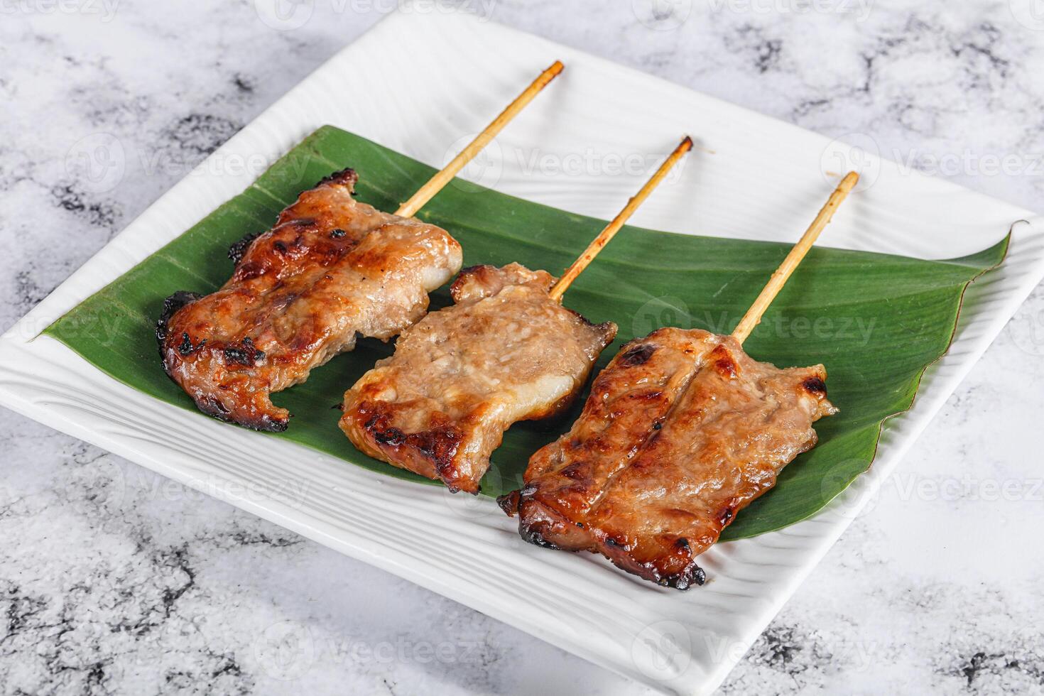 Thai cuisine - grilled pork skewer photo