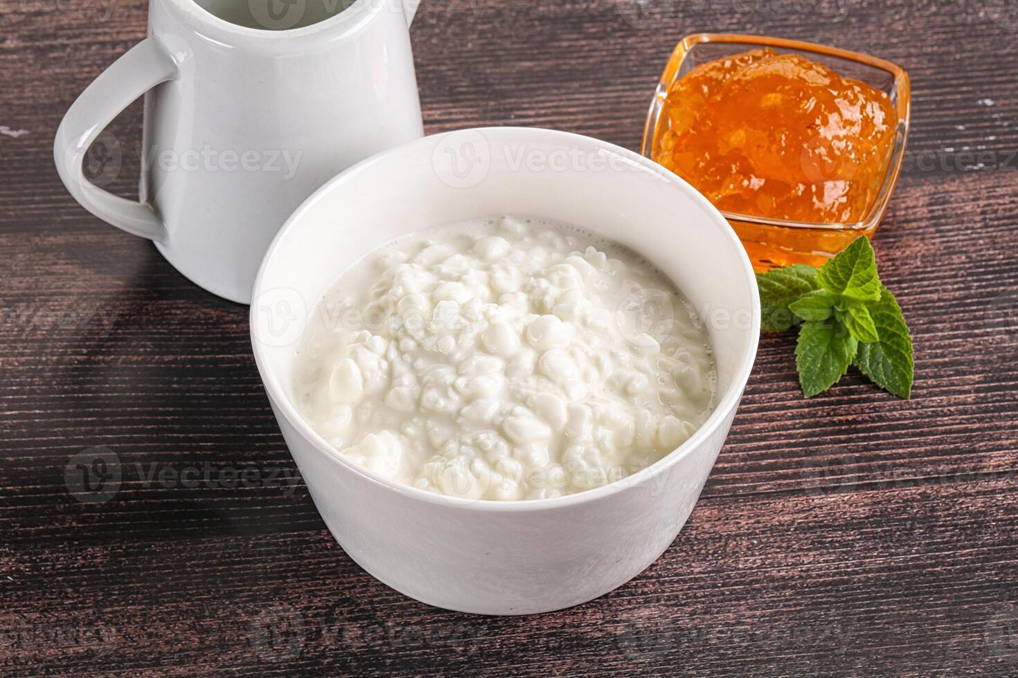Grain curd with cream and jam photo
