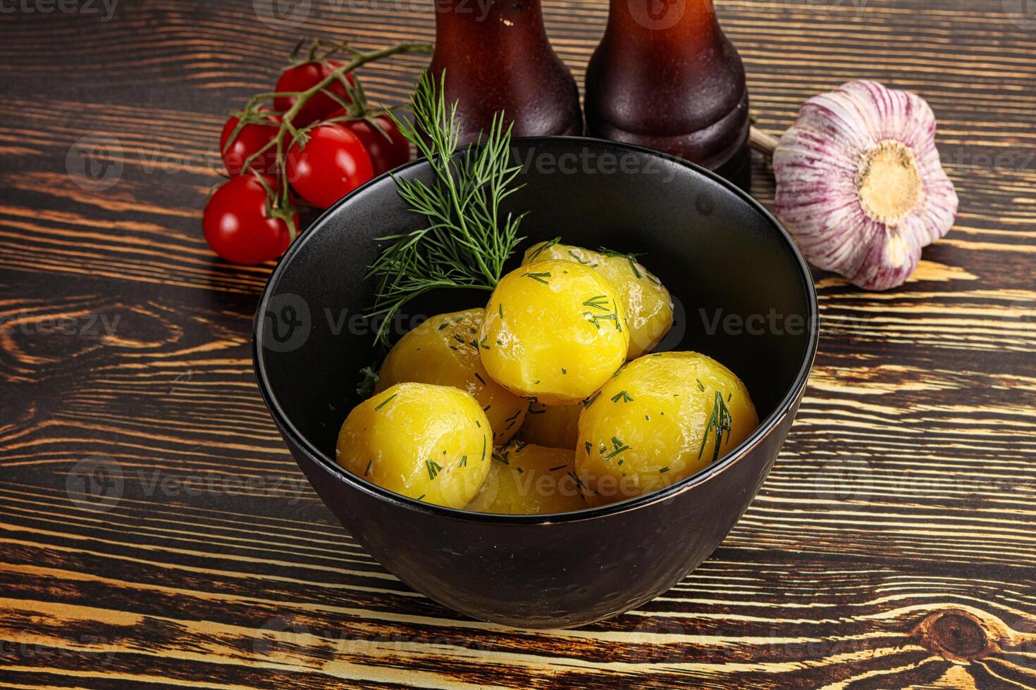 Boiled potato with oil and dill photo