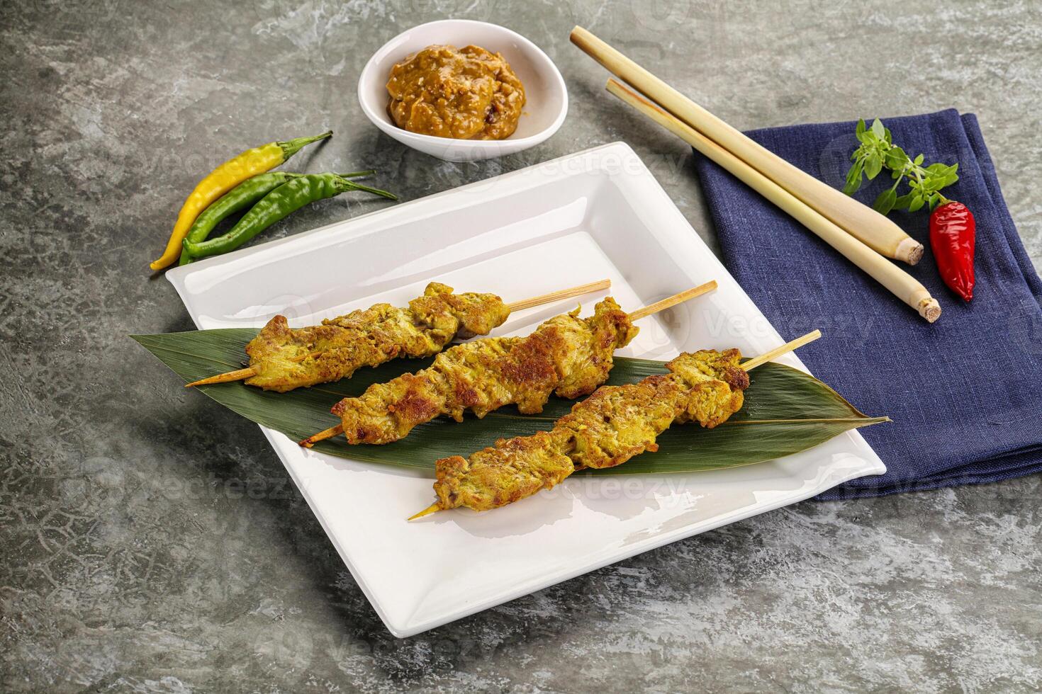 Thai meat skewer Satay with sauce photo