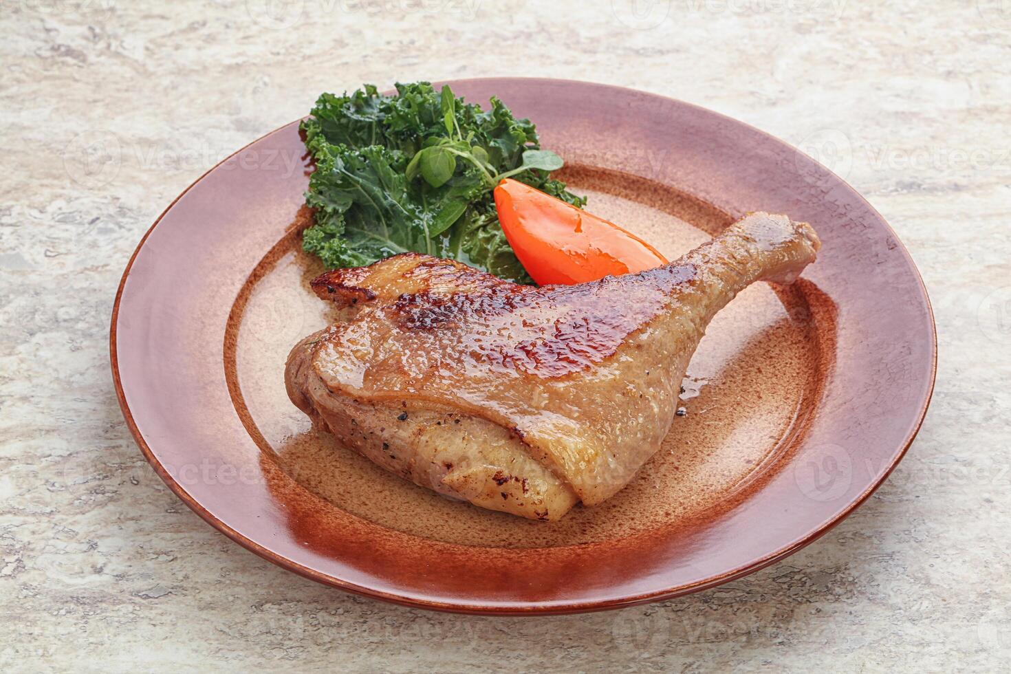 Roasted duck leg with orange sauce photo