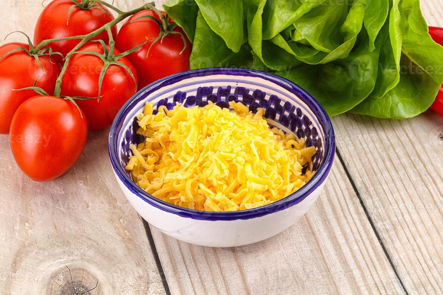 Shredded cheese in the bowl photo