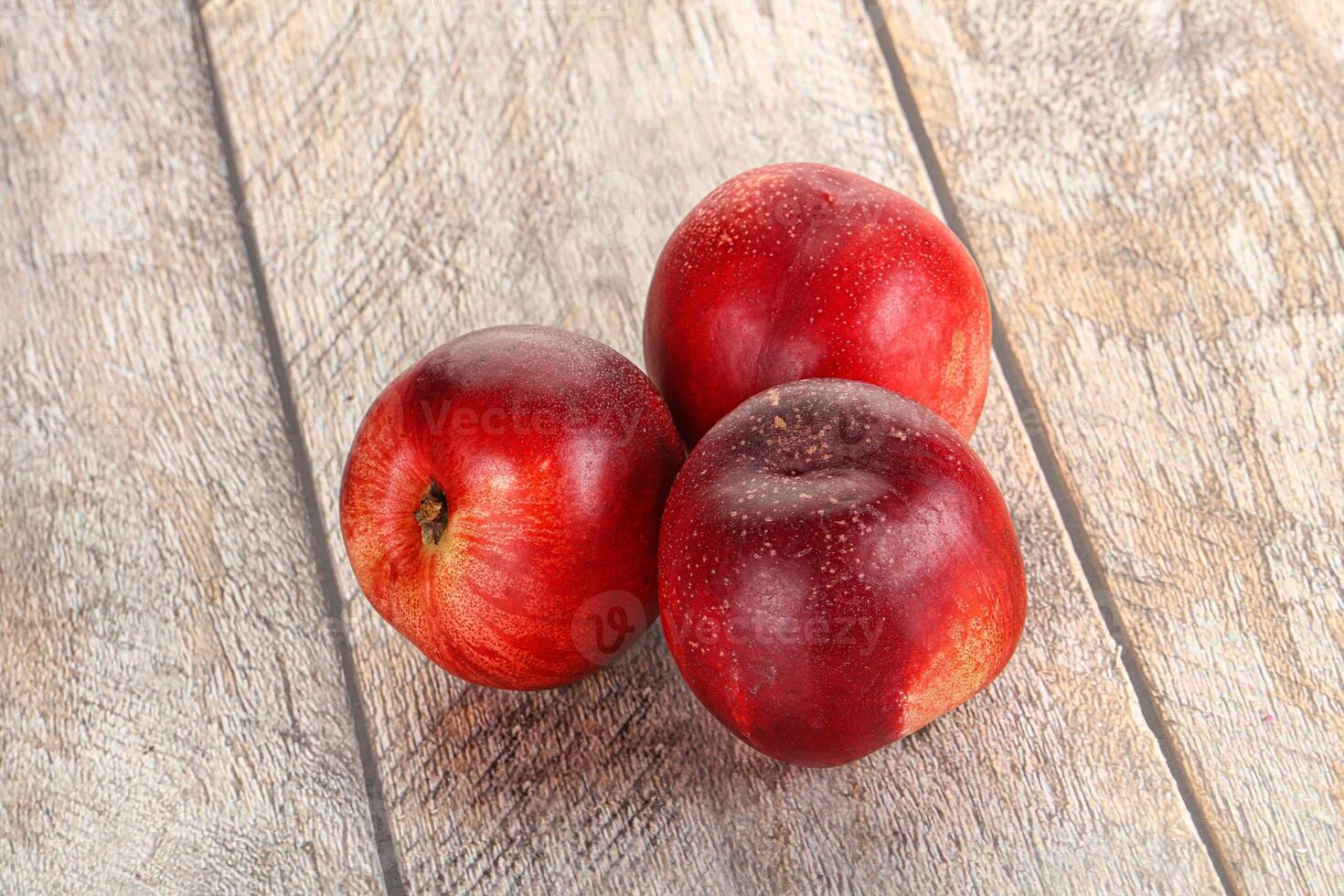 Ripe sweet juicy nectarines heap photo