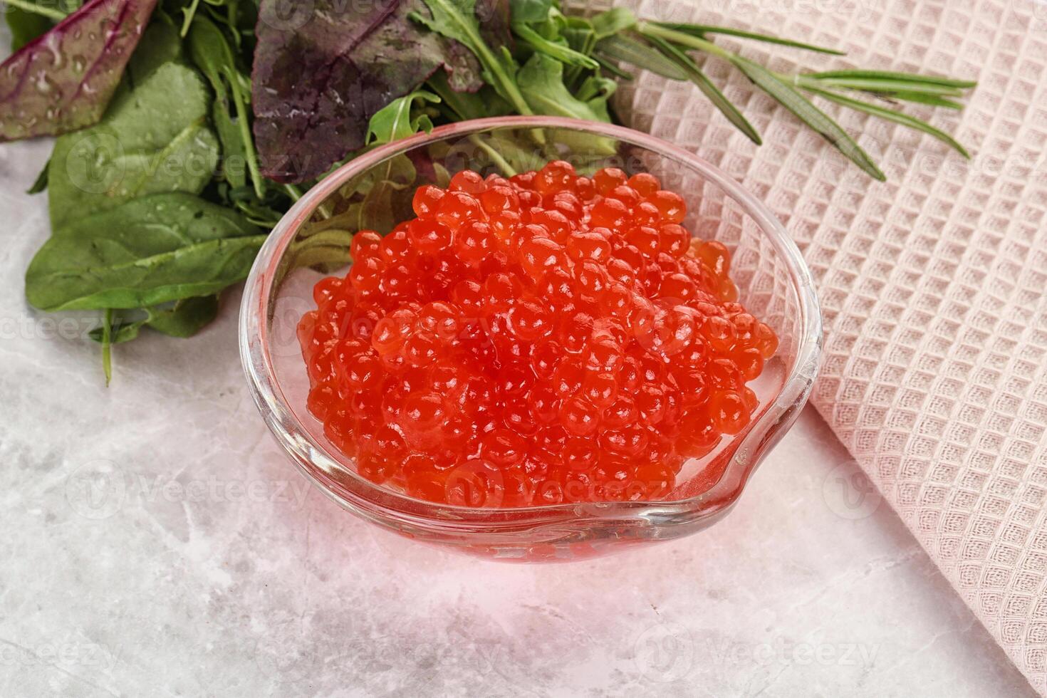 Red caviar in the bowl photo