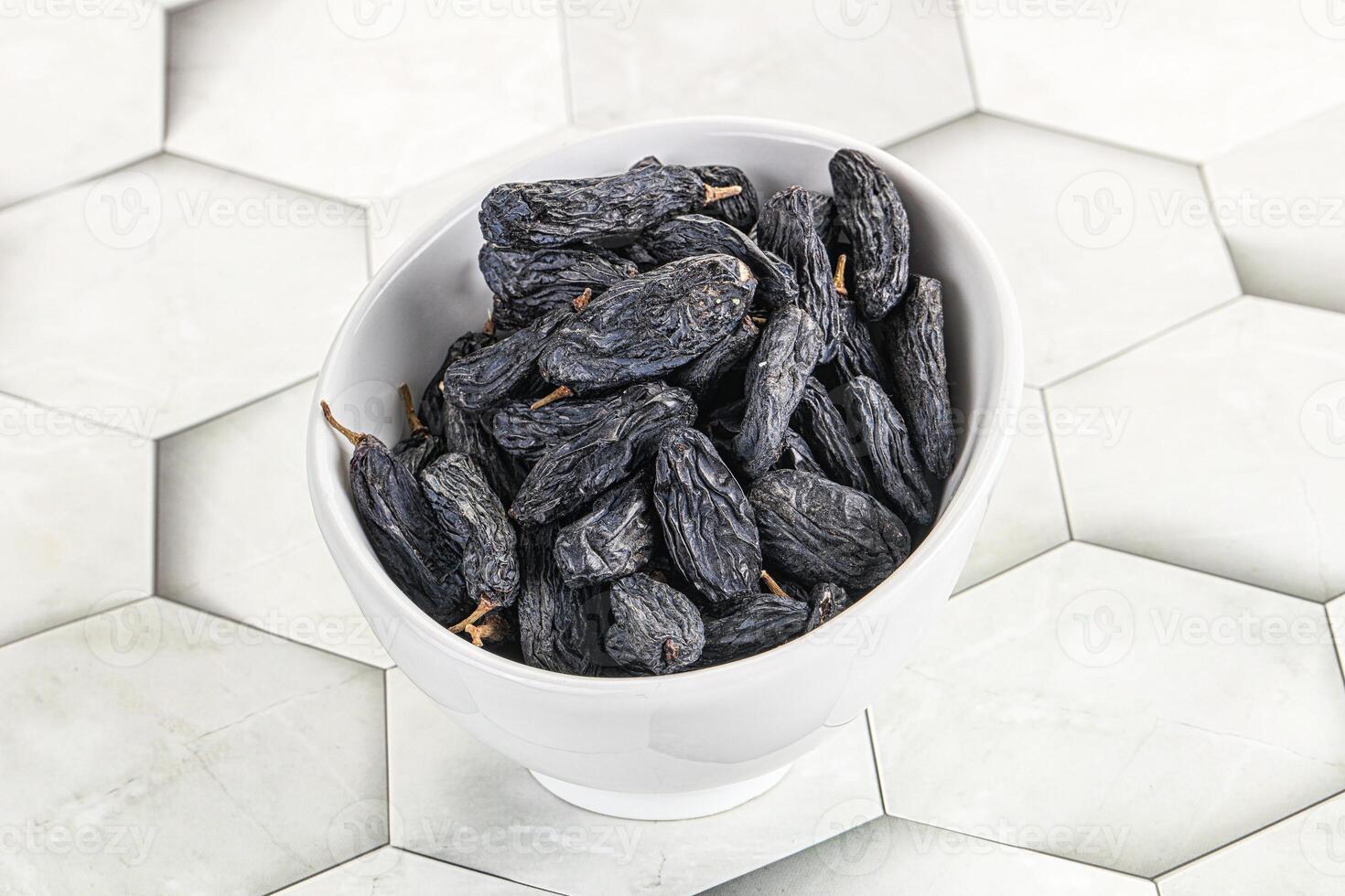 Blue raisin - dry grape berries photo