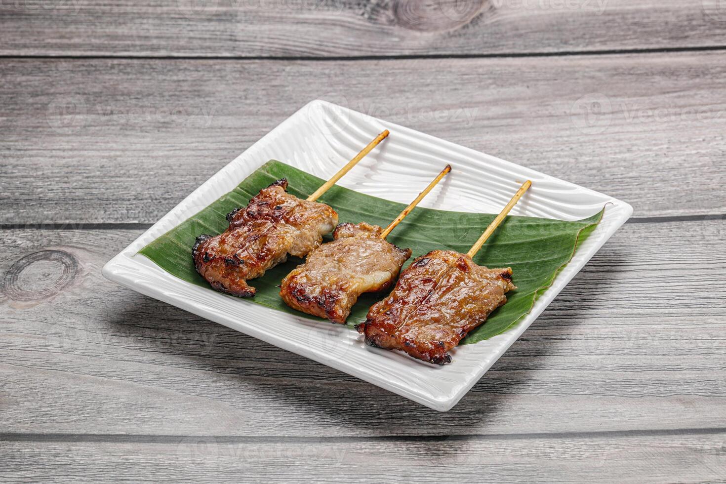 Thai cuisine - grilled pork skewer photo